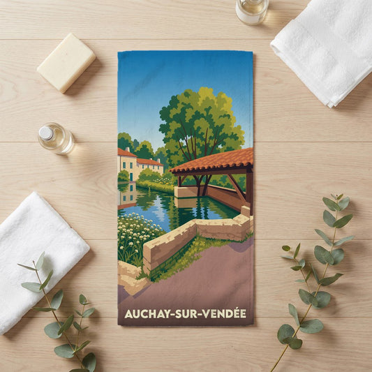Serviette de bain souvenir de la ville d'Auchay-sur-Vendée avec une illustration stylisée.