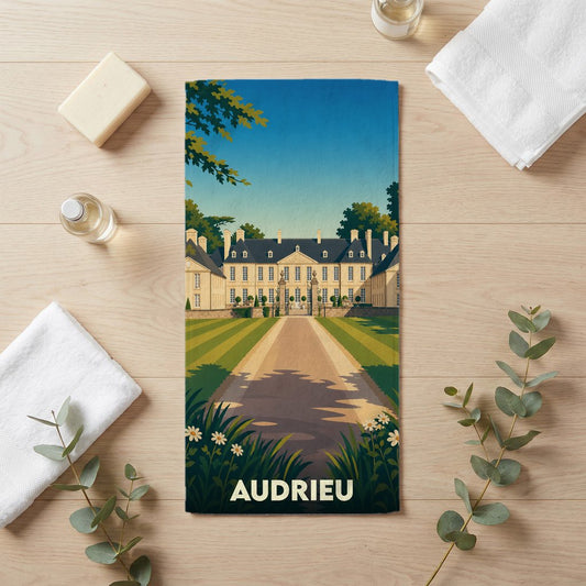 Serviette de bain souvenir de la ville d'Audrieu avec une illustration stylisée de son château.