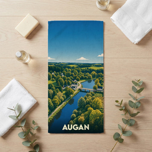 Serviette de bain souvenir de la ville d'Augan avec une illustration paysagère stylisée.