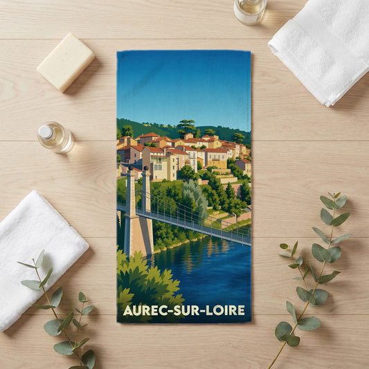 Serviette de bain souvenir de la ville d'Aurec-sur-Loire avec une illustration stylisée d'un pont et du village.