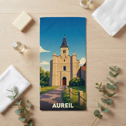 Serviette de bain souvenir de la ville d'Aureil avec une illustration stylisée de son église.