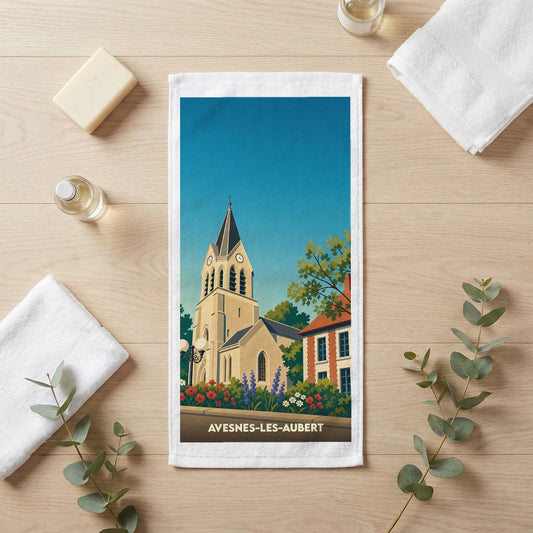 Serviette de bain souvenir de la ville de Avesnes-les-Aubert avec une illustration stylisée d'une église.