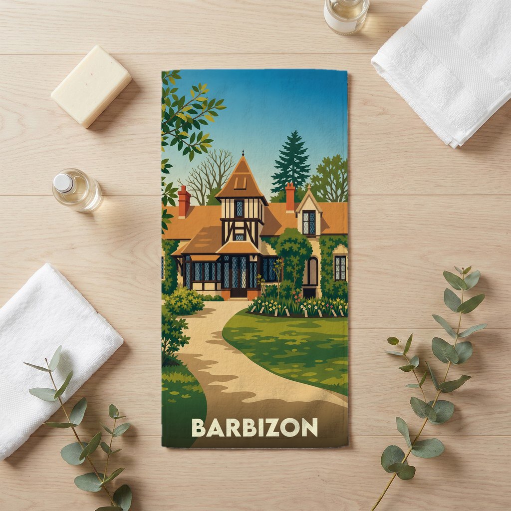 Serviette de bain souvenir de la ville de Barbizon avec une illustration stylisée d'une maison de campagne.