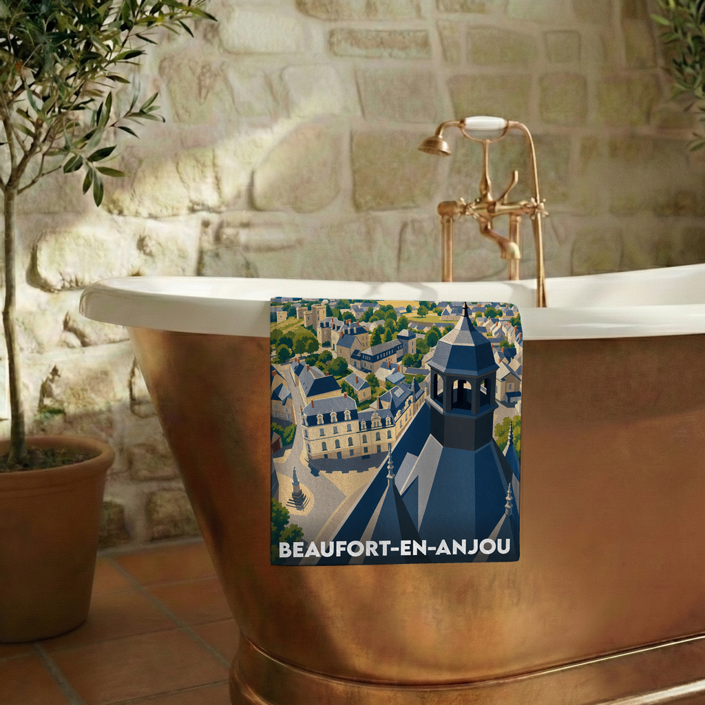 Serviette de bain souvenir de la ville de Beaufort-en-Anjou avec une illustration stylisée.