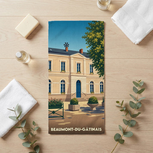 Serviette de bain souvenir de Beaumont-du-Gâtinais avec une illustration stylisée de la ville.