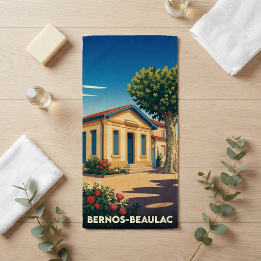 Serviette de bain souvenir de la ville de Bernos-Beaulac avec une illustration stylisée.