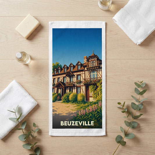 Serviette de bain souvenir de la ville de Beuzeville avec une illustration stylisée d'une maison à colombages.