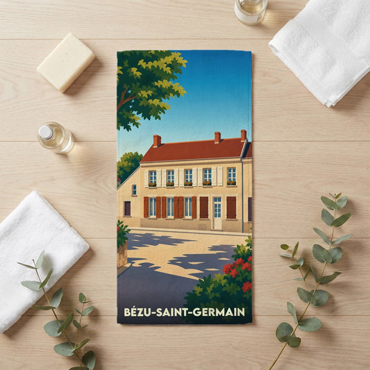 Serviette de bain souvenir de la ville de Bézu-Saint-Germain illustrée d'une maison de village typique.