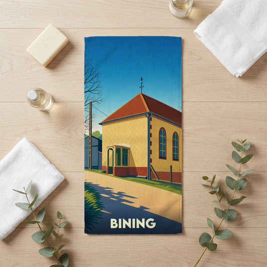 Serviette de bain souvenir de la ville de Bining avec une illustration stylisée.