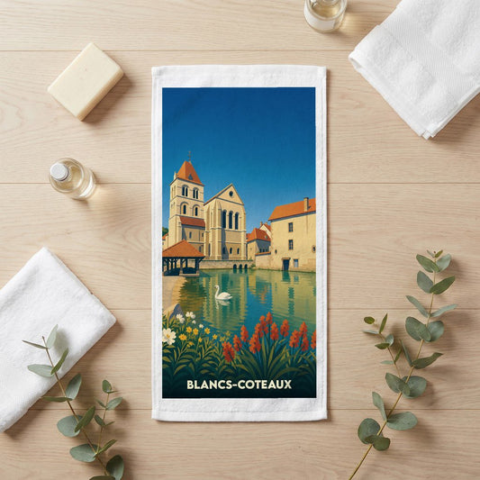 Serviette de bain souvenir de la ville de Blancs-Coteaux avec une illustration stylisée.