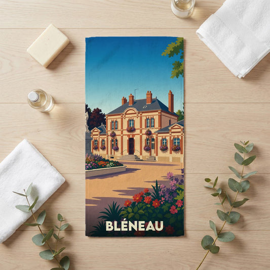 Serviette de bain souvenir de la ville de Bléneau avec une illustration stylisée d'un bâtiment historique fleuri.