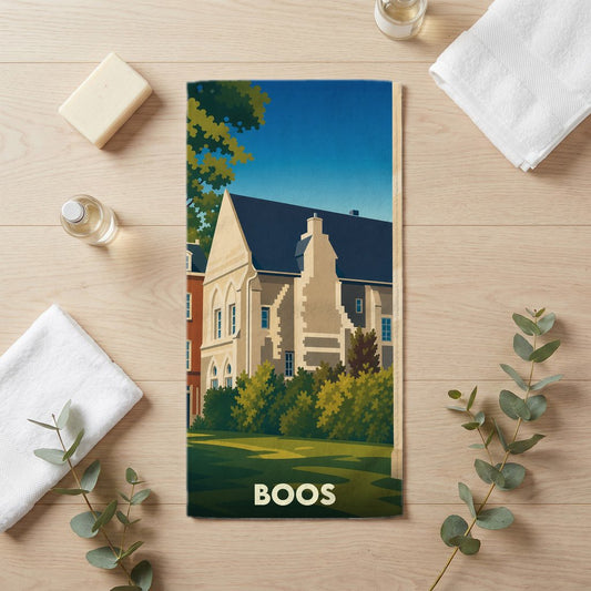 Serviette de bain souvenir de la ville de Boos avec une illustration stylisée d'un bâtiment historique.