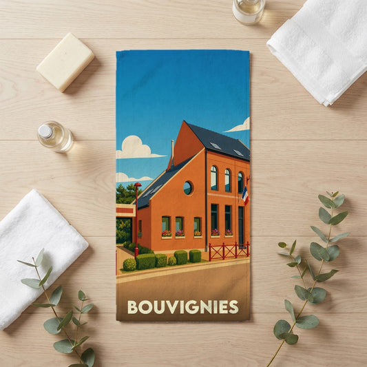 Serviette de bain souvenir de la ville de Bouvignies avec une illustration stylisée d'un bâtiment typique.