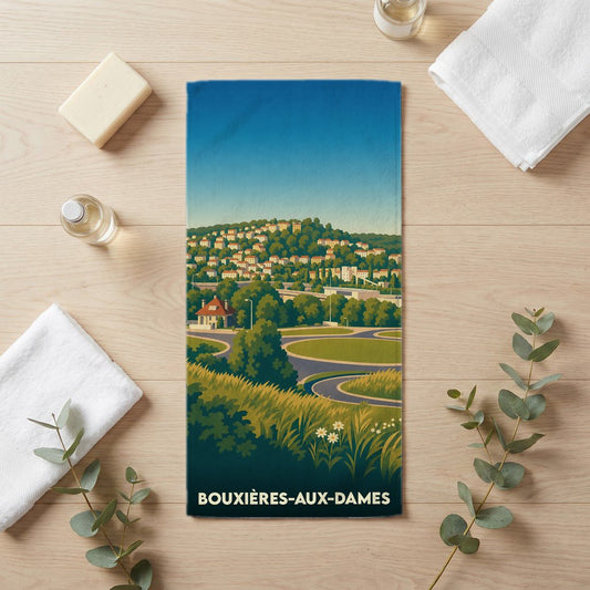 Serviette de bain souvenir de la ville de Bouxières-aux-Dames avec une illustration stylisée de son paysage.