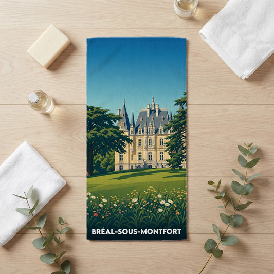 Serviette de bain souvenir de Bréal-sous-Montfort illustrée d'un château majestueux et d'un jardin fleuri.