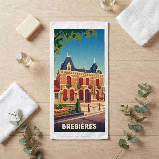 Serviette de bain souvenir de la ville de Brebières avec une illustration stylisée de son architecture.