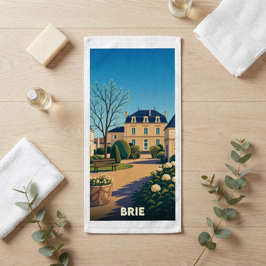 Serviette de bain souvenir de la ville de Brie ornée d'une illustration stylisée de son architecture.