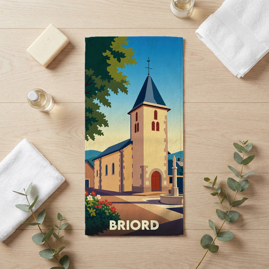 Serviette de bain souvenir de la ville de Briord illustrée d'une église de style vintage.