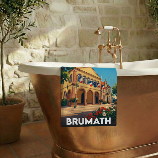 Serviette de bain souvenir de la ville de Brumath avec une illustration stylisée.