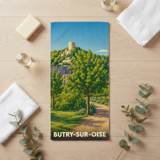 Serviette de bain souvenir de Butry-sur-Oise avec une illustration stylisée d'un paysage arboré et d'un château.