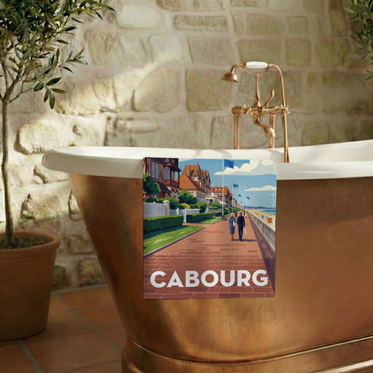 Serviette de bain souvenir de la ville de Cabourg avec une illustration stylisée.