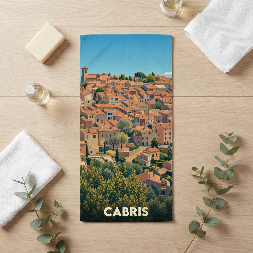 Serviette de bain souvenir de la ville de Cabris avec une illustration stylisée d'un village provençal.