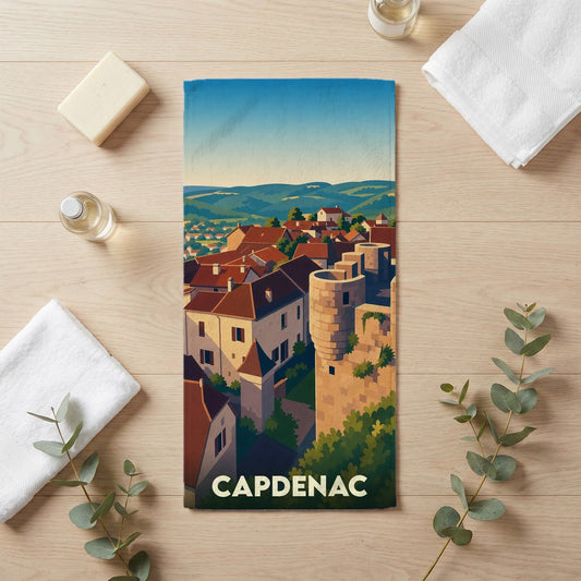 Serviette de bain souvenir de la ville de Capdenac avec une illustration stylisée de ses remparts et de ses toits.