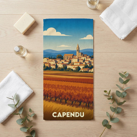 Serviette souvenir de la ville de Capendu avec une illustration stylisée de son paysage et de ses vignobles.