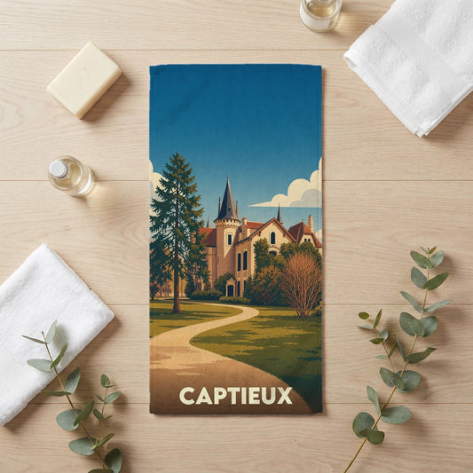 Serviette de bain souvenir de la ville de Captieux illustrant un château dans un parc arboré au style rétro.