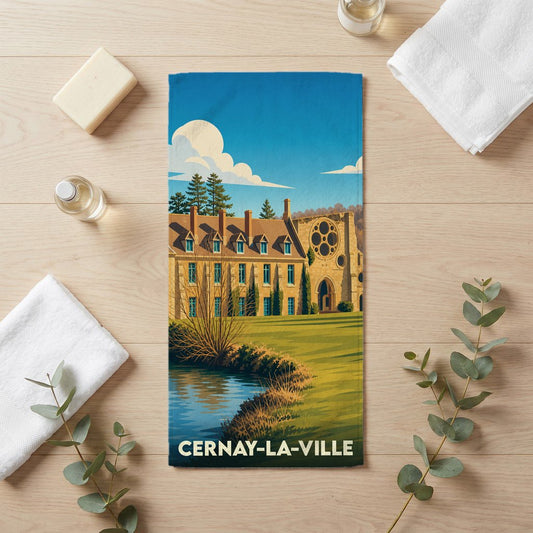 Serviette de bain souvenir de la ville de Cernay-la-Ville avec une illustration stylisée de son abbaye.