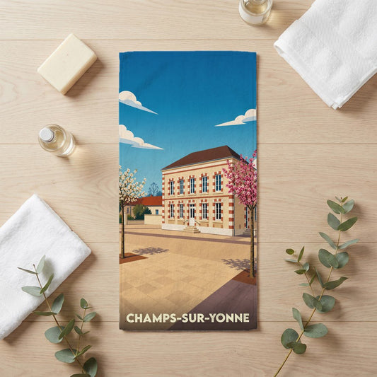 Serviette de bain souvenir de la ville de Champs-sur-Yonne avec une illustration stylisée.