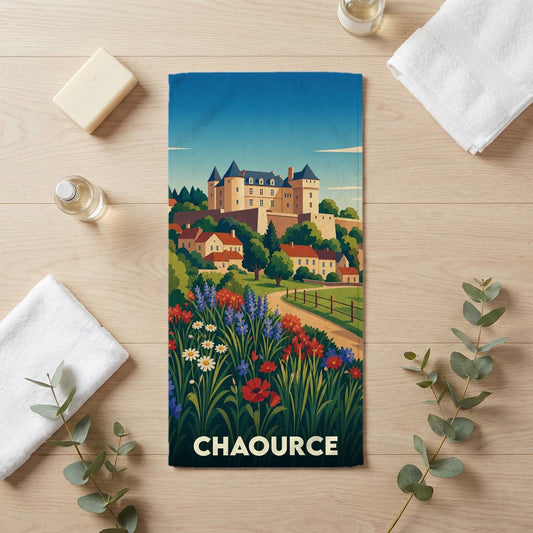 Serviette de bain souvenir de la ville de Chaource illustrée d'un château surplombant un village fleuri.