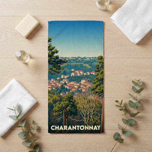 Serviette de bain souvenir de la ville de Charantonnay avec une illustration stylisée de son paysage urbain.