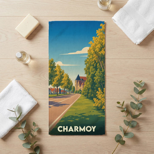 Serviette de bain souvenir de la ville de Charmoy avec une illustration stylisée de paysage urbain.