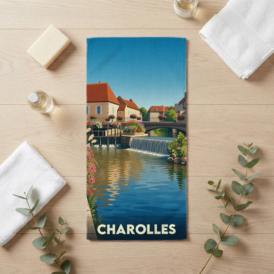 Serviette de bain souvenir de la ville de Charolles avec une illustration stylisée de ses canaux et de son architecture.