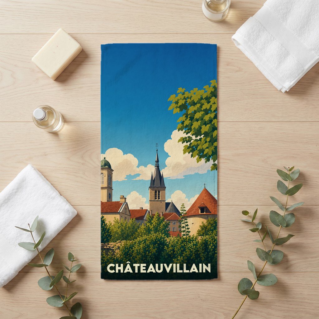 Serviette de bain souvenir de la ville de Châteauvillain avec une illustration stylisée.