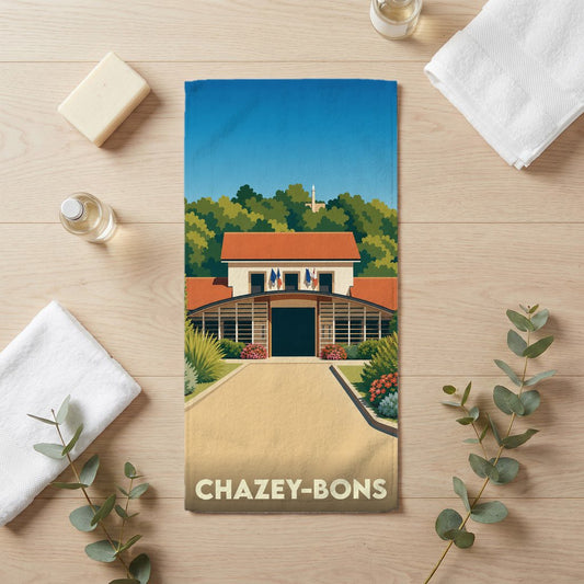 Serviette de bain souvenir de Chazey-Bons avec une illustration stylisée de son patrimoine.