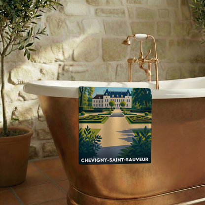 Serviette de bain souvenir de la ville de Chevigny-Saint-Sauveur avec une illustration stylisée d'un château.