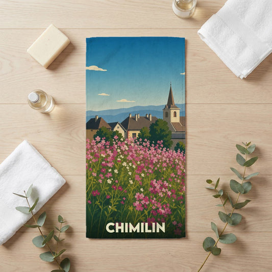 Serviette de bain souvenir de la ville de Chimilin avec une illustration stylisée d'un champ de fleurs et d'un clocher.
