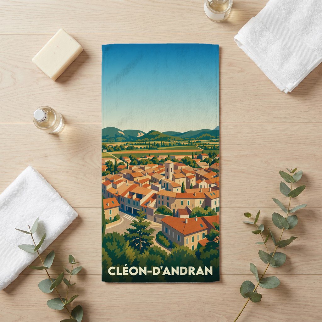Serviette de bain souvenir de la ville de Cléon-d'Andran avec une illustration stylisée.