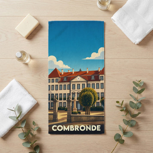 Serviette de bain souvenir de la ville de Combronde avec une illustration stylisée.