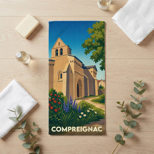 Serviette de bain souvenir de la ville de Compreignac avec une illustration stylisée de son église.