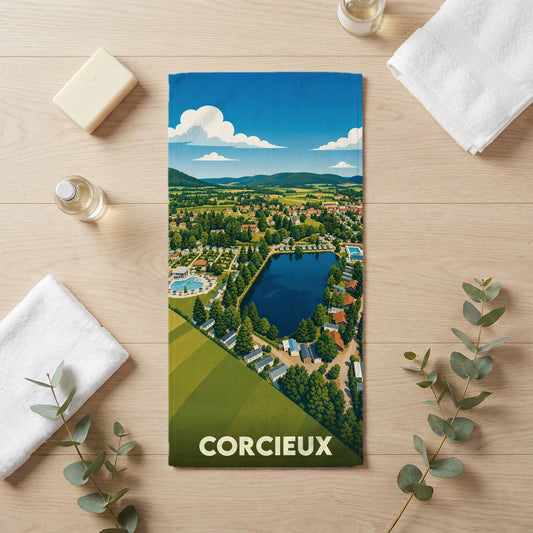 Serviette de bain souvenir de la ville de Corcieux avec une illustration paysagère stylisée.