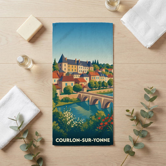 Serviette de bain souvenir de Courlon-sur-Yonne avec une illustration stylisée du village et de son pont.