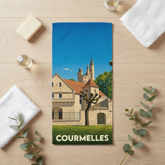 Serviette de bain souvenir de la ville de Courmelles avec une illustration stylisée d'un château.