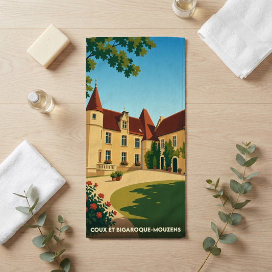 Serviette de bain souvenir de la ville de Coux et Bigaroque-Mouzens avec une illustration stylisée d'un château.