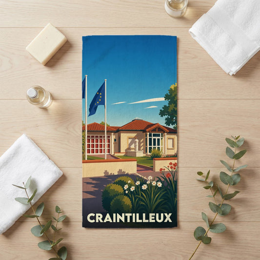 Serviette de bain souvenir de la ville de Craintilleux avec une illustration stylisée.