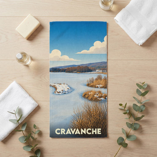 Serviette de bain souvenir de la ville de Cravanche avec une illustration hivernale stylisée.