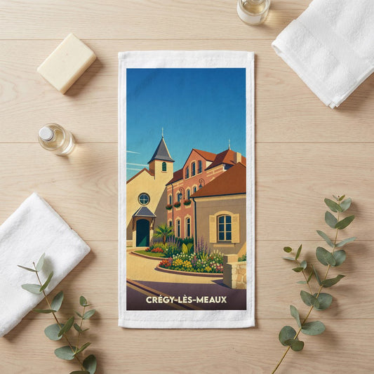 Serviette de bain souvenir de la ville de Crégy-lès-Meaux avec une illustration stylisée.