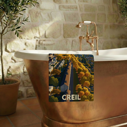 Serviette de bain souvenir de la ville de Creil avec une illustration stylisée.